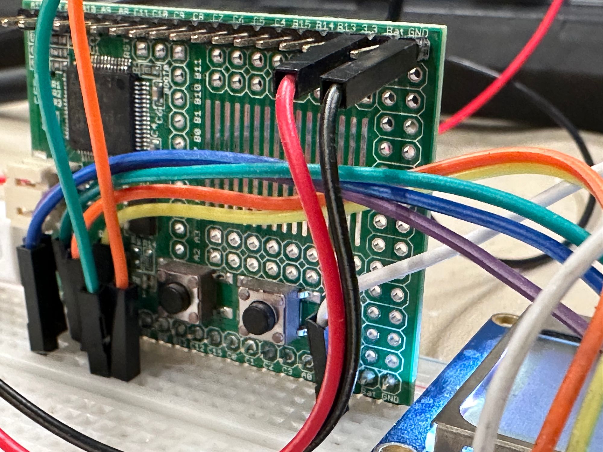 Original Espruino board mounted on a solderless breadboard with a variety of colored jumper wires.